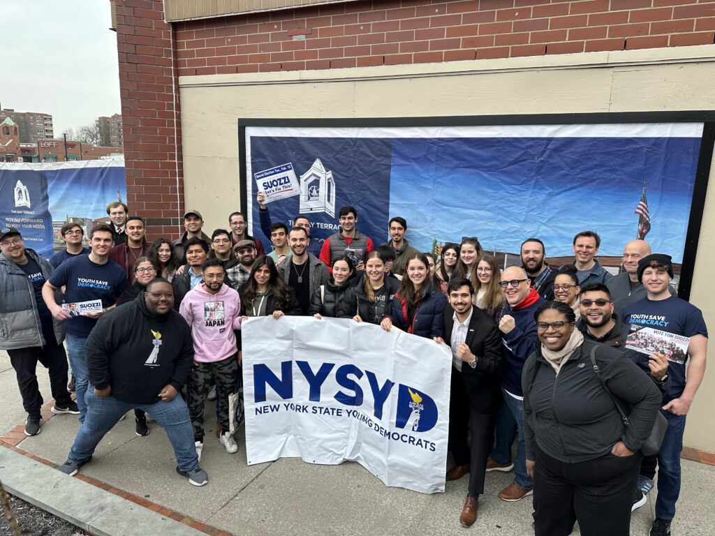 Members outside a canvass