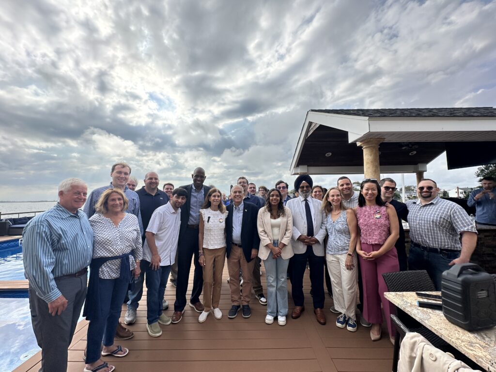 Group of people on a back deck on the water